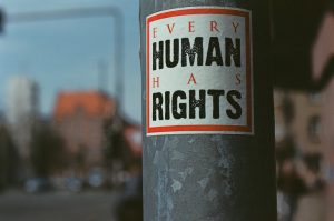Sign that reads 'every human has rights'.